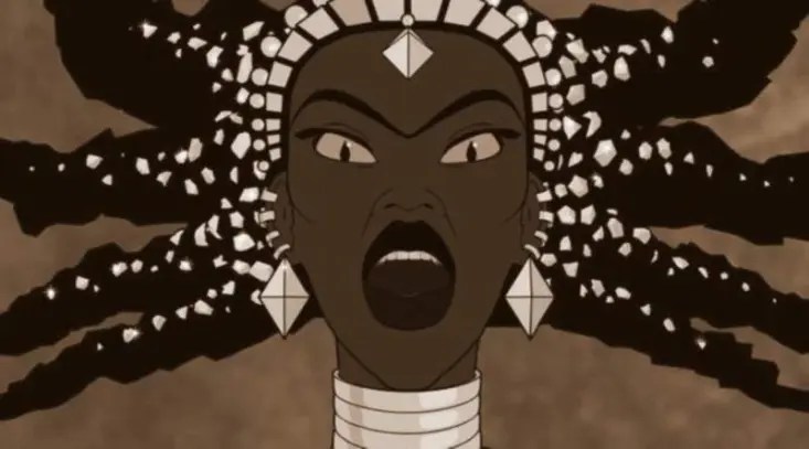 Photogramme du film Kirikou et la sorcière : gros plan sur le visage de Karaba la sorcière, criant, les yeux écarquillés (image correspondant certainement à la scène où Kirikou lui retire l’épine du dos).